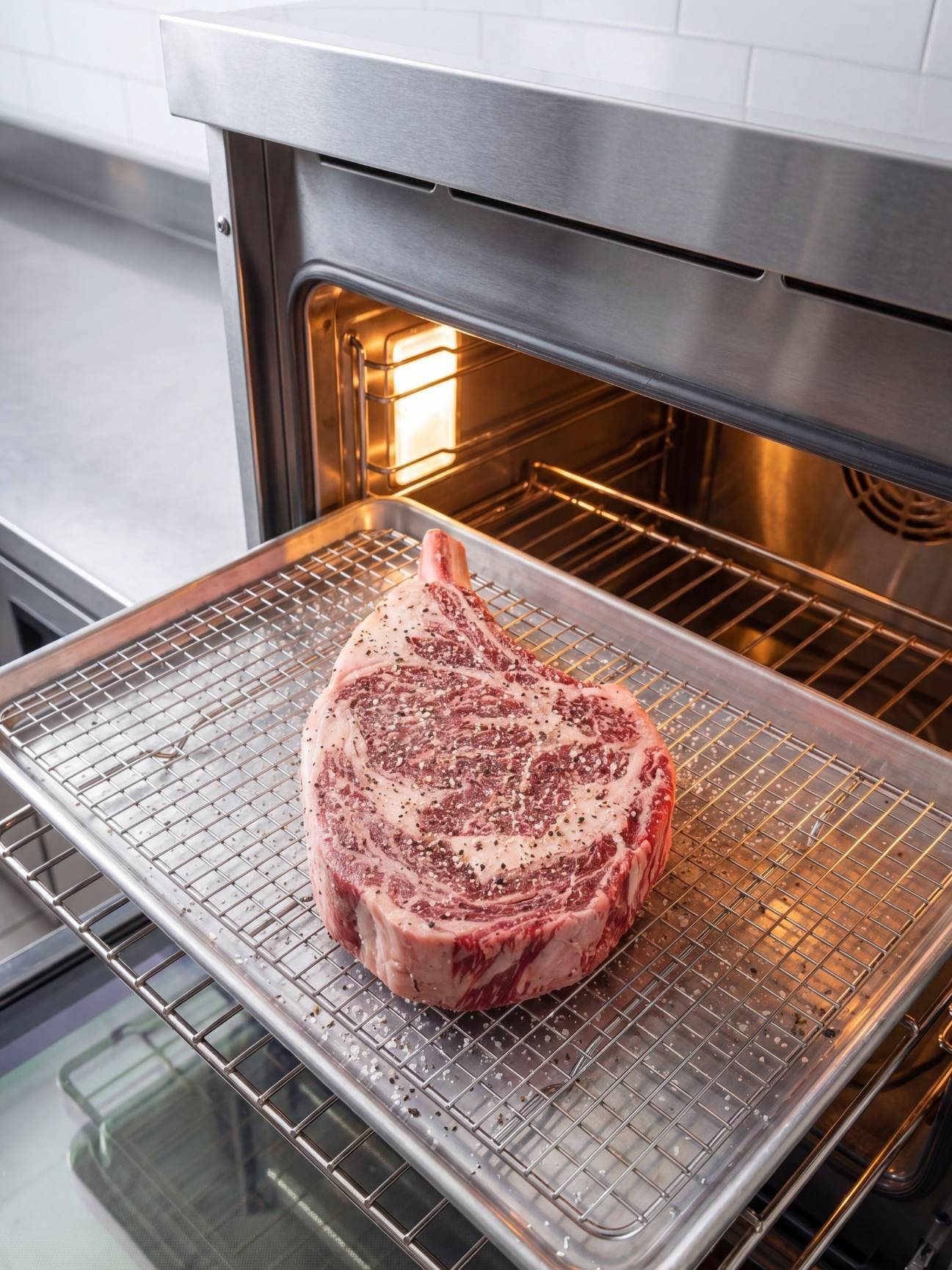 wagyu beef tomahawk steak recipe steak on rack in oven reverse sear cooking method