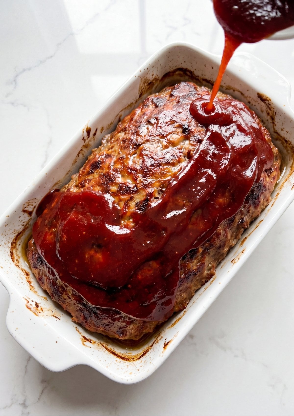 Collage showing a whole glazed meatloaf on top and a sliced meatloaf on the bottom with the text 1 lb meatloaf recipe.