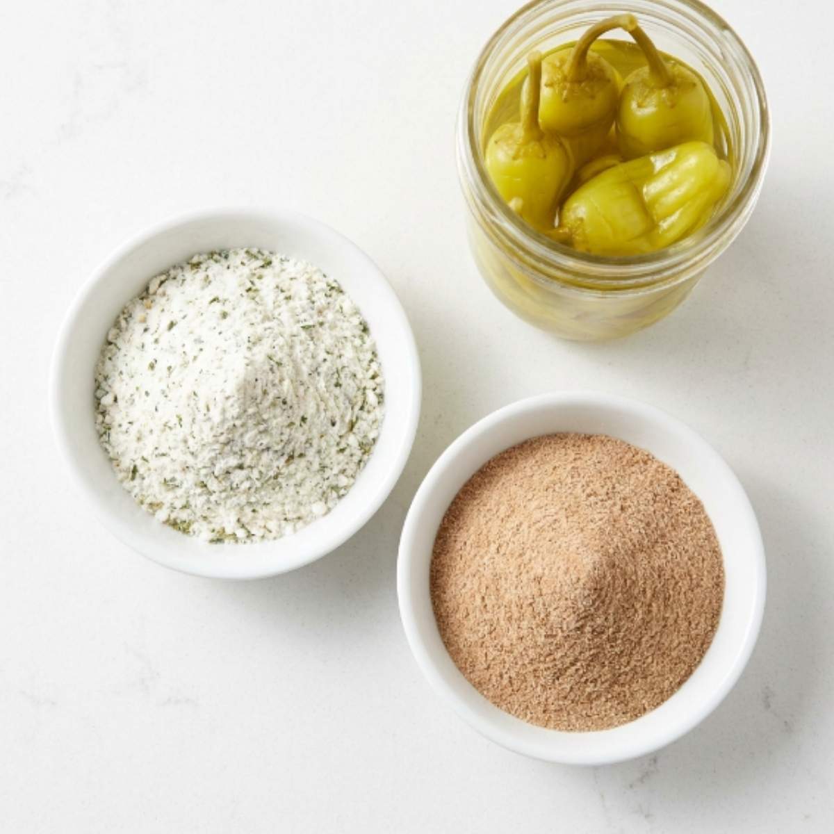 white-bowls-of-ranch-seasoning-and-au-jus-gravy-mix-with-a-jar-of-pepperoncini-peppers