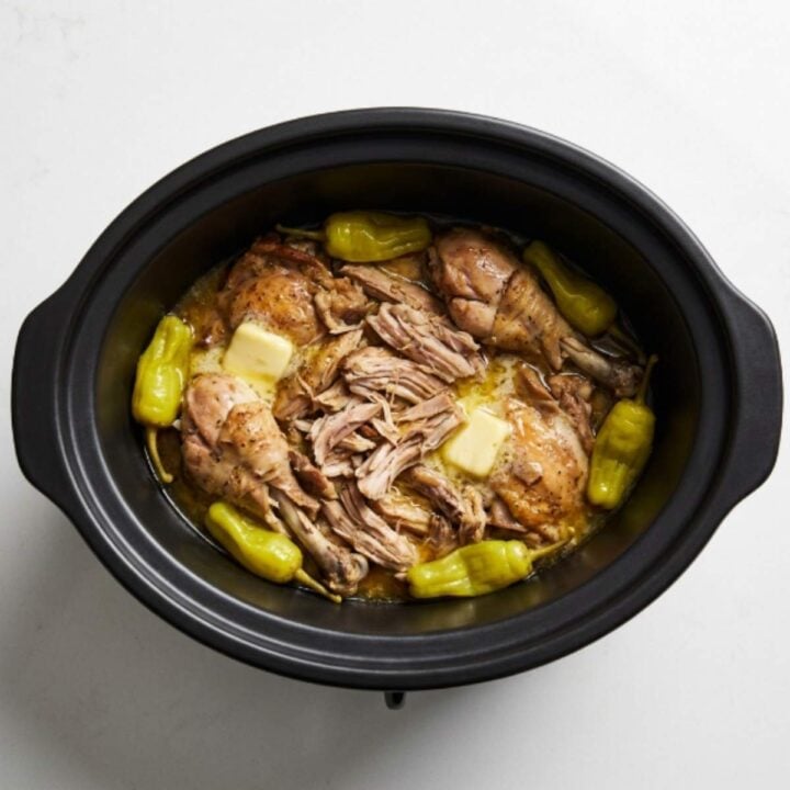 chicken mississippi pot roast in a slow cooker with pepperoncini and butter