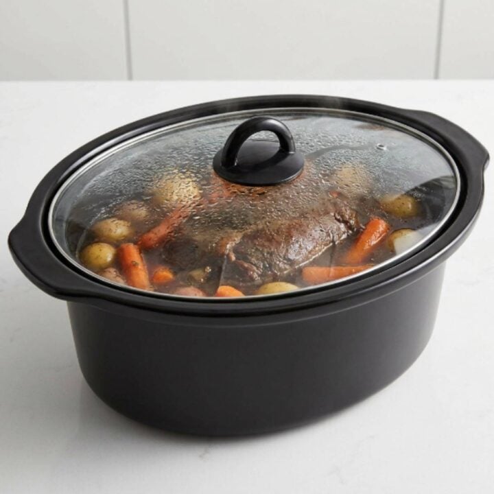 mississippi pot roast with potatoes and carrots in a slow cooker