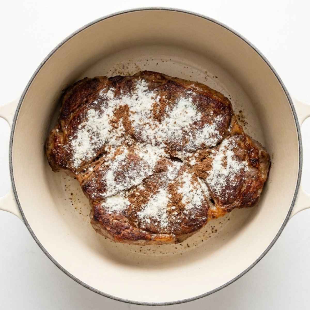 seared-chuck-roast-in-a-dutch-oven-sprinkled-with-dry-ranch-and-au-jus-seasoning-mixes