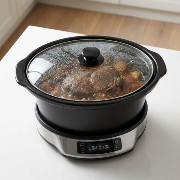 mississippi-pot-roast-with-potatoes-and-carrots-cooking-with-the-lid-on-a-digital-slow-cooker